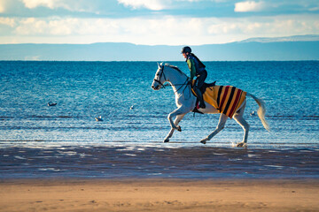 Riding on the beach