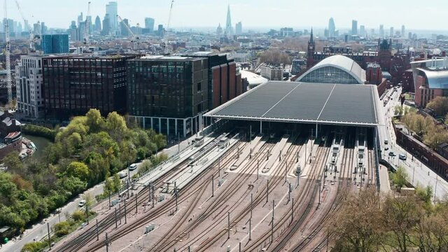 Rising pan down drone shot of train tracks from London st Pancras station