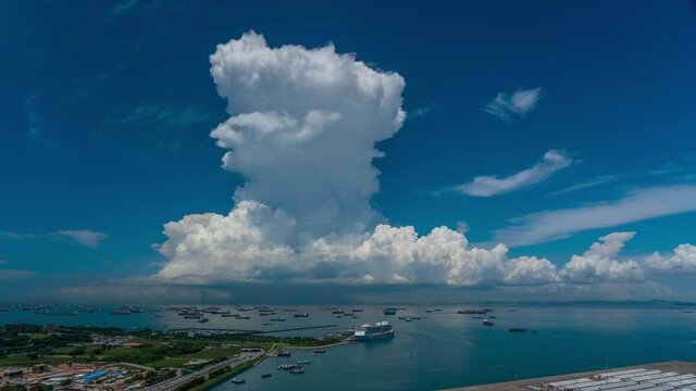 Giant cumulonimbus clouds explode at the ocean - 4K30p timelapse video.