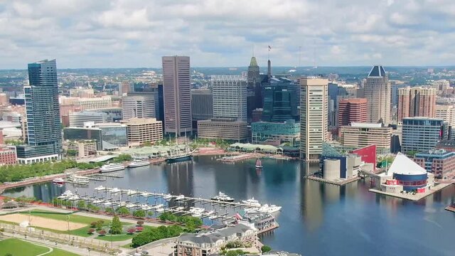 Inner Harbor, Baltimore, Maryland. Cityscape on a sunny summer day with cloudy sky