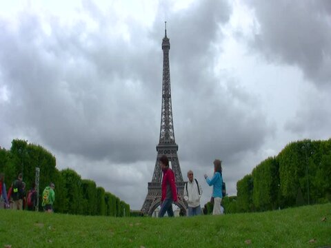 People passing by the Eiffel Tower , Timelapse