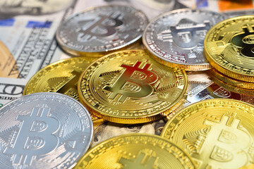 Heap bitcoin money and dollar banknotes.