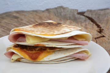 ham and cheddar and mozzarella cheese crepe