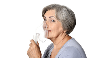 Portrait of elderly woman with flu inhalation