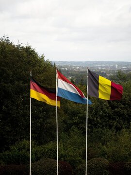 German dutch and belgian flags at triple border point Drielandenpunt Les Trois Bornes Dreilandereck, Vaalserberg Europe