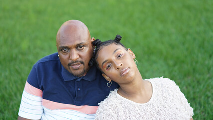 Family Portrait of Father and Daughter on Grassy Backyard,