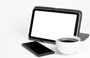 digital tablet, coffee and smartphone on light gray background