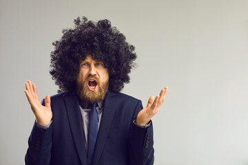 Misunderstanding, frustration people emotion. Funny puzzled clueless man in afro hair wig angry...