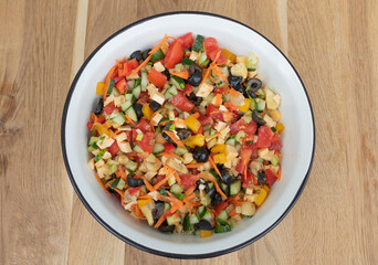 Greek salad with many vegetables like olive, tomatoes, - pressed cheese, cucumber - carrot and other ingredients. Benefits