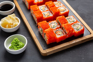 California Maki Sushi with Masago - Roll made of Crab Meat, Avocado, Cucumber inside.
