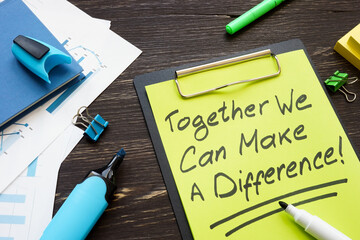Together we can make a difference slogan on the clipboard.
