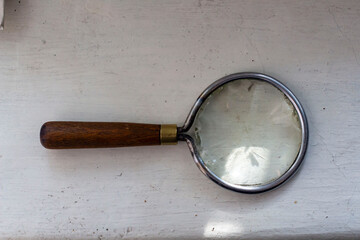 Group of old vintage retro loupes magnifier on canvas top view, searching concept