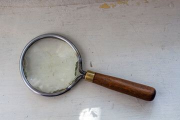 Group of old vintage retro loupes magnifier on canvas top view, searching concept