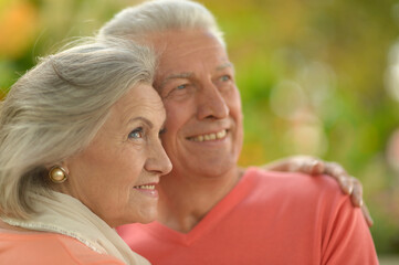Happy senior woman and man  in park