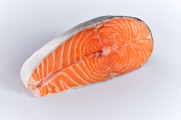 Raw salmon fish steak on white background