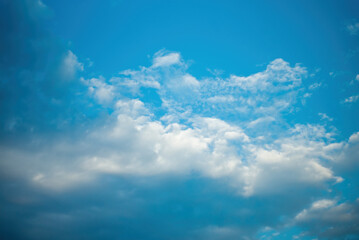 blue sky background with tiny clouds.