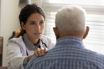 We shall fight your disease together. Professional doctor oncologist talk to upset aged male...