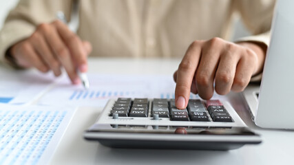 Close-up shot of Hand using calculator,Business concepts.