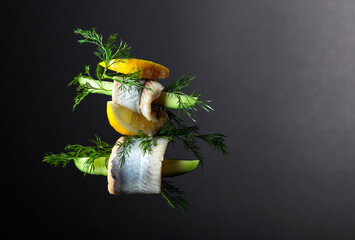 Herring fillet in oil with lemon, cucumber, and dill.