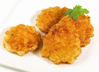 Pommes Exquisine - Potato Preparation with Cornflakes on white Background. Isolated