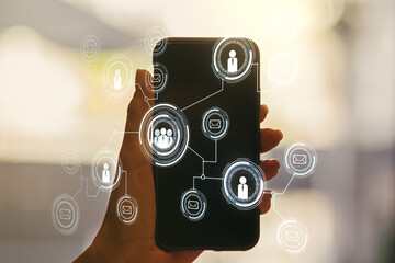 Social network media concept and hand with mobile phone on background. Double exposure