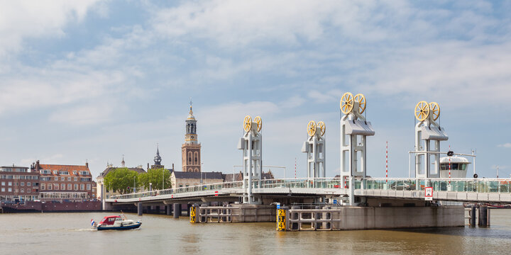 Summer view of the river IJssel with entrance bridge of the Hanseatic historic city of Kampen, The Nertherlands