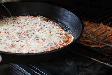 cheese pizza in the oven