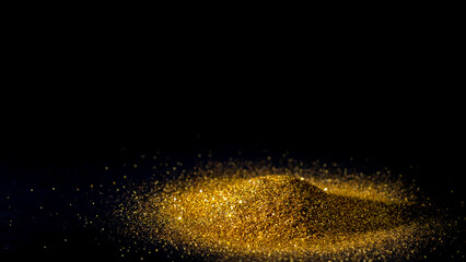 Fototapeta na wymiar Elegant and precious sparkling golden powder pile on black background.
