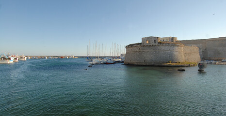 Fototapeta premium Gallipoli is a town of Salento on the coast of Puglia. The historic center is on an island offshore. In the ancient port the atmosphere is Mediterranean.