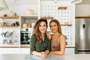 Portrait of a two beautiful women at home.