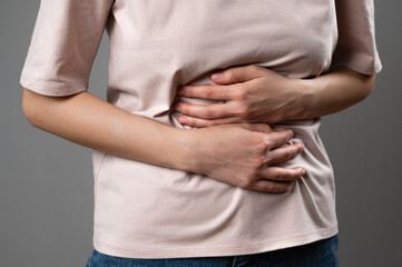 A woman with indigestion in the stomach