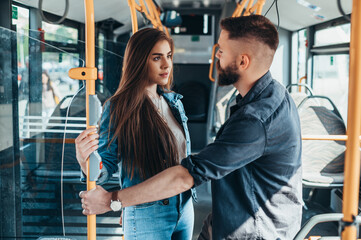 Couple in love looking each other in the bus