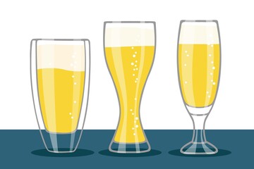 Set of Beer glasses isolated on table. Three different forms glasses of beer with foam and bubbles. Oktoberfest background Concept for pub, bar, restaurant menu, party decor, beverage drinks template