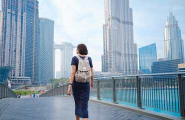 Fototapeta na wymiar Young beautiful woman enjoying the view of Dubai downtown.