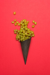 Chocolate ice cream cone and grape