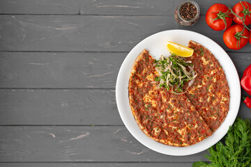 Baked homemade flatbread on wooden background close up