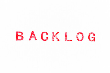Red color rubber stamp in word backlog on white paper background
