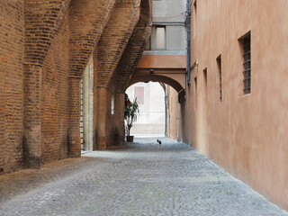 Ferrara, Italy. Closed-end alley next to the Municipal Theater. Cobbled street, on the left an old...