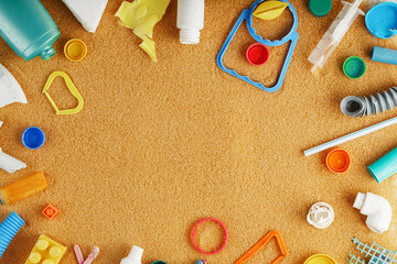 Fototapeta na wymiar Garbage made of colorful plastic on an oceanic sandy beach.