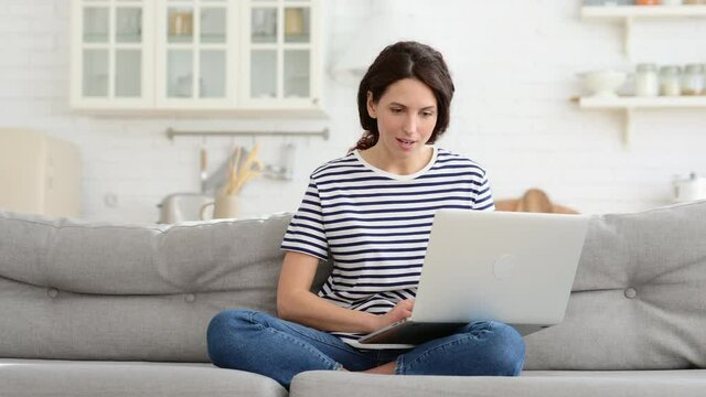Cheerful woman type on laptop, messaging or working online from home laugh make ridiculous mistake and facepalm, get funny chat message communicate with friend. Positive millennial female freelancer