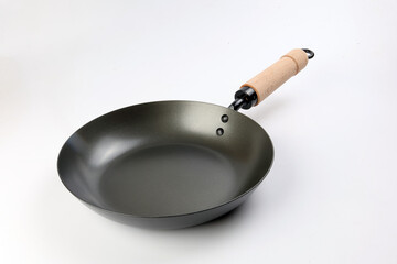 Cast metal not stick t wooden handle empty flat bottom frying sauce pan on white background