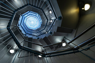 Fototapeta premium Interior view of modern spiral stairway. Building abstract background