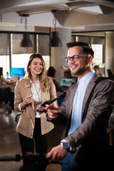 Portrait of handsome businessman. Man with electric scooter