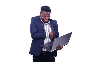 young businessman using a laptop computer smiling.