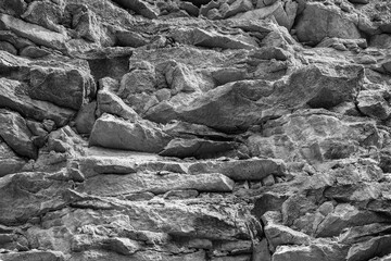 Old rustic jagged cragged strata grunge of rugged rock. Uneven ragged granite slabs of aged canyon....