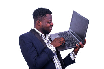 young businessman working on the laptop smiling.