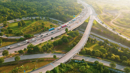 Aerial Drone top down Of heavy traffic on highway multi-level junction road with moving cars 