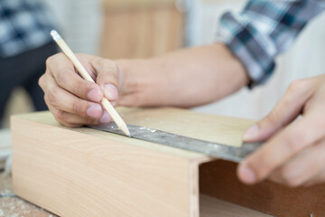Carpenter working,hammer,meter on construction background.