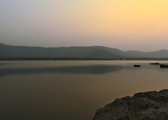 Panoramic after sunset landscape view of beautiful Kasarsai dam situated in Pune, Maharashtra, India