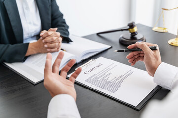 Lawyer discuss the contract and legal document agreement in office. Law and legal concept